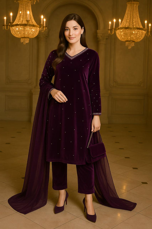 Woman in a dark purple traditional outfit with a matching shawl in an elegant interior setting.