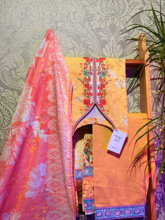 Colorful traditional outfit with floral patterns on a stand against a patterned wall.